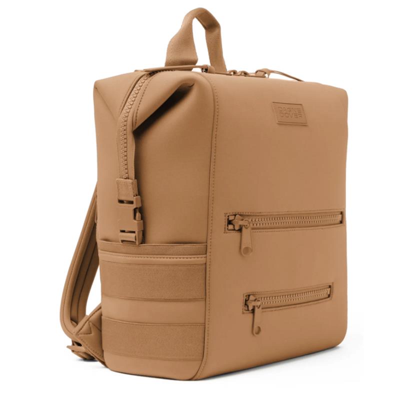 Large camel-colored Dagne Dover Indi Diaper Backpack featuring zippers and structured design for practicality.