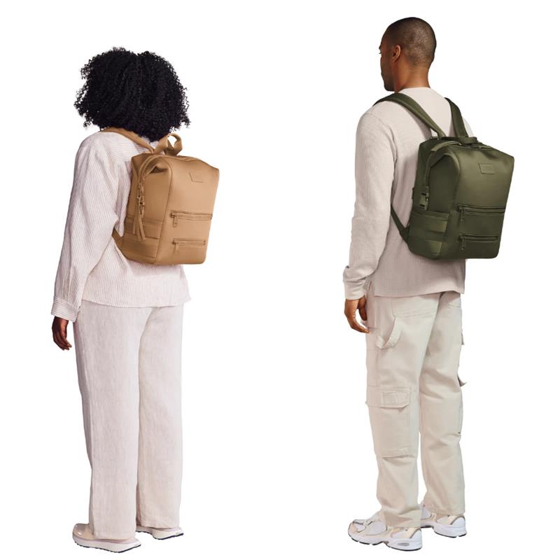 Large Dagne Dover Indi Diaper Backpack in camel worn by a woman, next to a man wearing a green version.