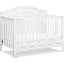DaVinci Charlie 4-In-1 Convertible Baby Crib in white, featuring slatted sides and an arched top design.