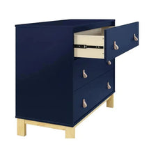 Delta Children BabyGap Legacy 3 Drawer Dresser in navy and natural, featuring leather pulls and one open drawer.