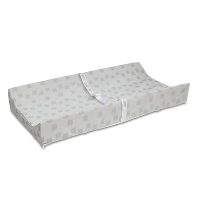 Waterproof contoured changing pad by Delta Children, featuring a gray pattern and safety straps for secure use.