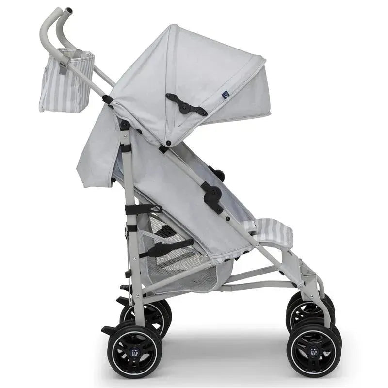 Lightweight Delta Gap Classic Umbrella Stroller in grey with a canopy and storage pouch, designed for easy mobility.