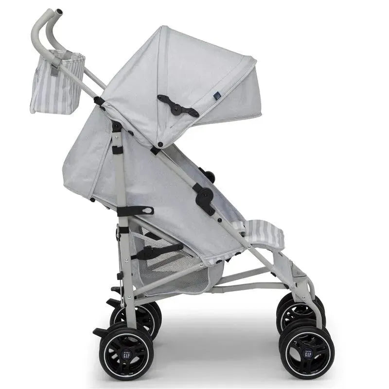 Grey Delta Gap Classic Umbrella Lightweight Stroller with a canopy and storage bag.