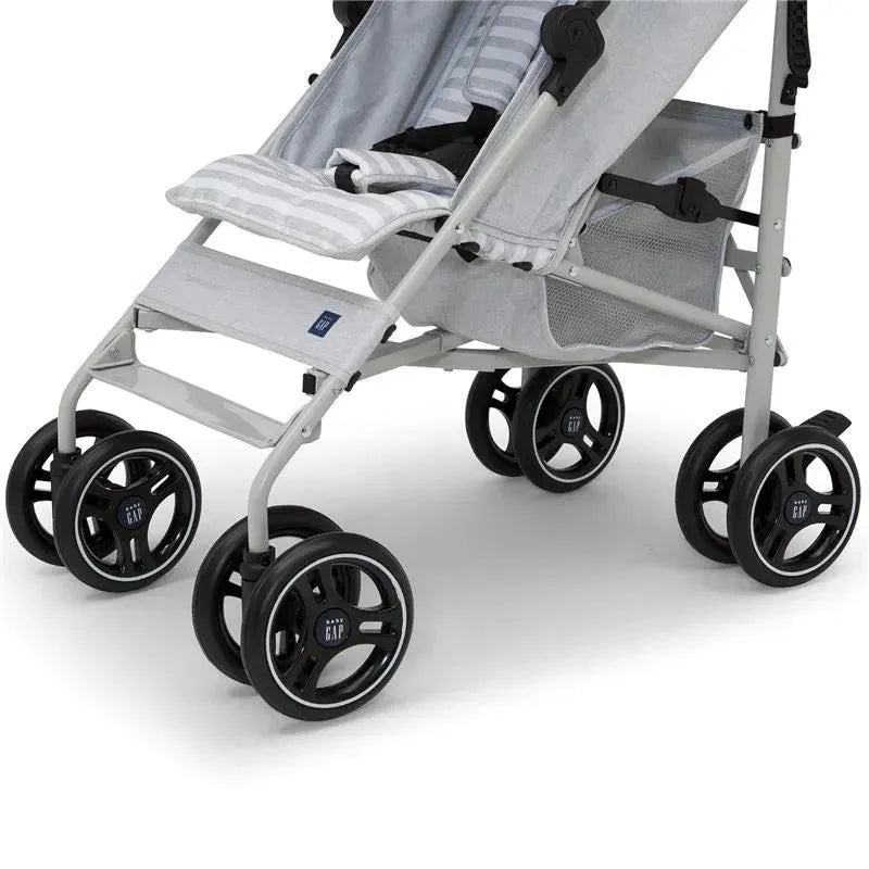 Lightweight grey Delta Gap Classic Umbrella stroller with black wheels and a mesh storage basket.