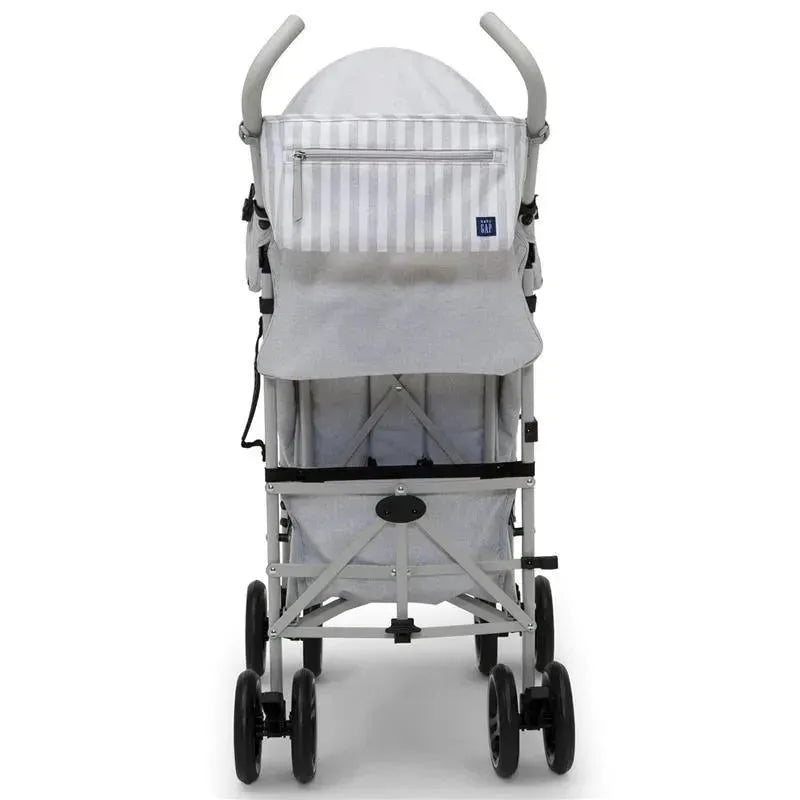 Gap Classic Umbrella Stroller in grey, featuring a lightweight frame and a striped canopy, designed for easy transport.