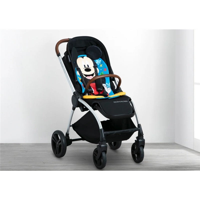 Mickey Mouse themed seat pad stroller insert featuring colorful designs and a supportive harness for child comfort.