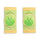 Green and yellow dinosaur-themed knee pads with cheerful dinosaur faces, designed for infants.
