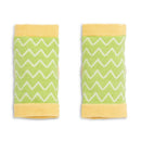 Green and yellow knee pads for infants with a zigzag pattern, designed for protection while crawling.