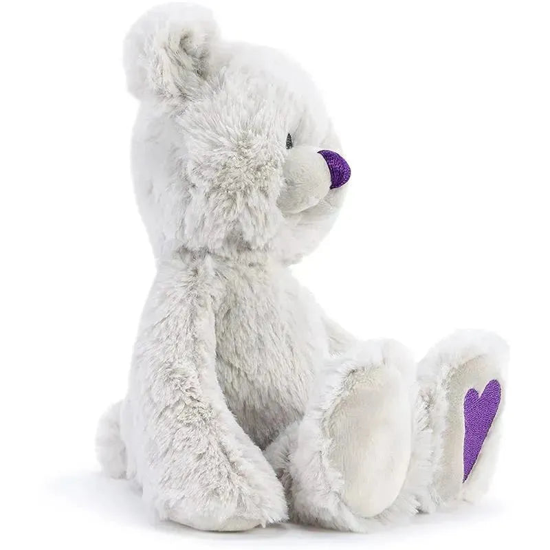 February Birthstone plush bear with a soft white fur, purple nose, and heart details on its paw.