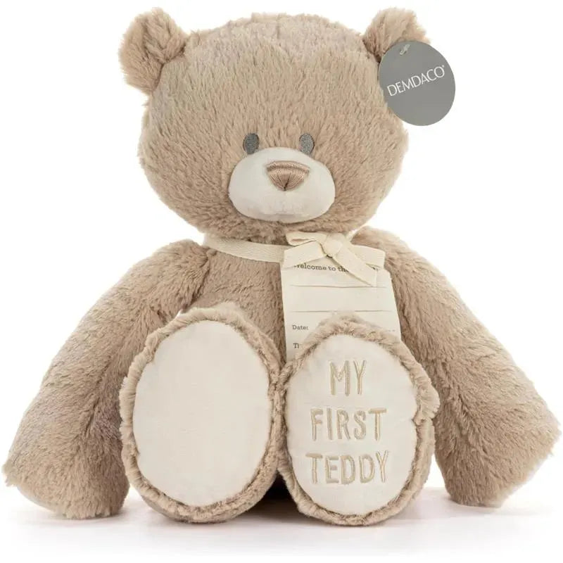 Demdaco My First Teddy Bear, 16 inches tall, featuring a neutral beige color, with embroidered text on its paw.