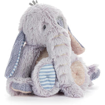 Soft plush elephant toy with textured fabrics and pastel colors, featuring floppy ears and a cute expression.