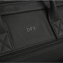 Black DFY diaper backpack featuring textured material, zippers, and subtle branding. Ideal for parents on the go.