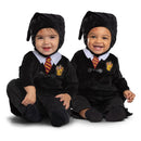 Two toddlers wear official Harry Potter costumes, featuring black robes with Gryffindor emblems and distinctive hats.
