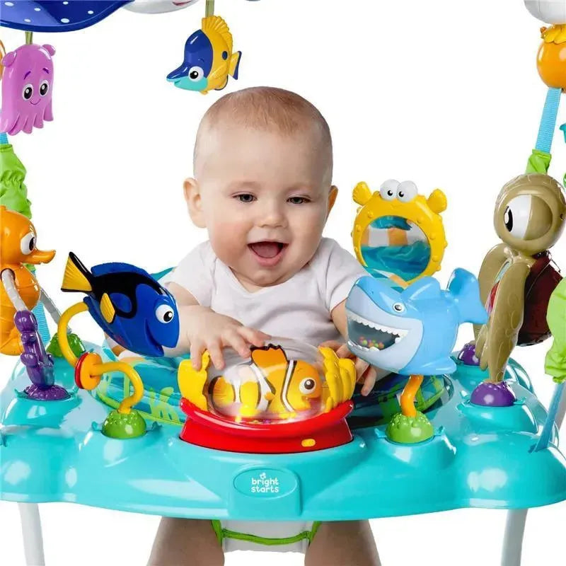 Baby joyfully interacts with colorful fish toys in the Disney Baby Finding Nemo Sea of Activities Jumper.