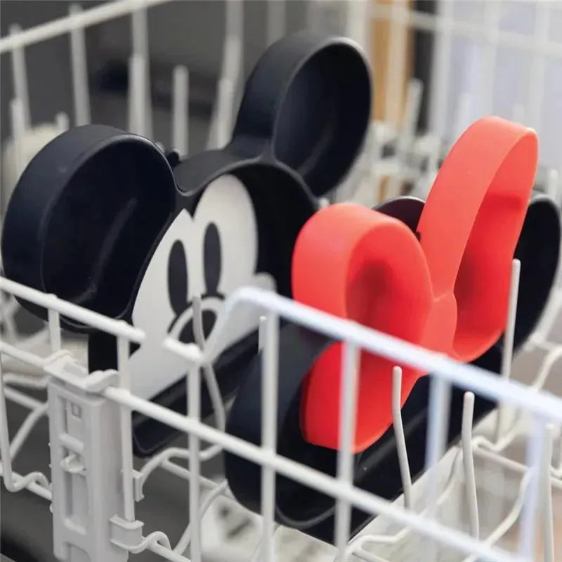 Silicone dish featuring Winnie the Pooh design, shown in a dishwasher.