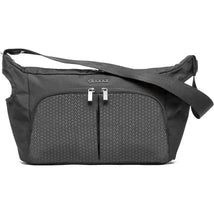 Doona Essentials Bag in Nitro Black, featuring a sleek design with two front zippered pockets and an adjustable strap.