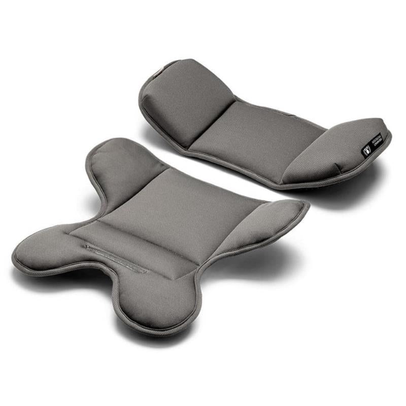Infant car seat padding in gray fabric, designed for comfort and safety, featuring a contoured shape for support.