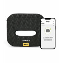 Lab SensAlert Pad by Doona, featuring a handle cutout and “This side up” text beside a smartphone displaying the SensAlert app.