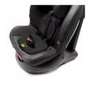 Doona Lab SensAlert Pad placed in a child car seat, featuring a textured black surface and a red release button.