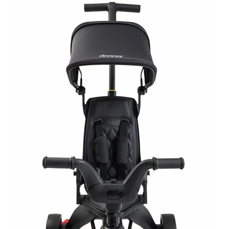 Doona Liki Trike S5 in Midnight color featuring a black seat, harness, and adjustable canopy.
