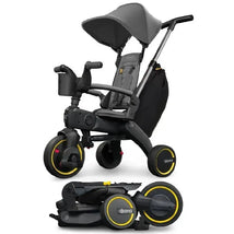 Doona Liki Trike S3 in Grey Hound color, featuring a compact design with a folding mechanism and safety harness.
