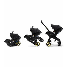 Doona Infant Car Seat and Stroller in Midnight, showcasing three configurations: car seat, stroller, and car seat attached to stroller.
