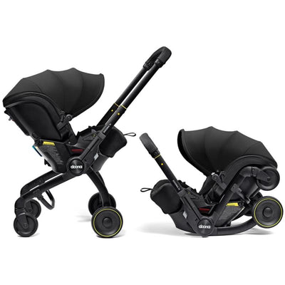 Doona X Infant Car Seat & Latch Base in Nitro Black with adjustable canopy and swivel wheels.
