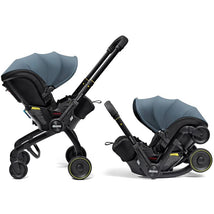 Doona X Infant Car Seat & Latch Base in Ocean Blue, featuring a sleek design with a removable canopy and dual-position handle.