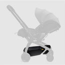 Black Doona X Storage Basket attached to a Doona stroller, designed for convenient storage underneath the seat.