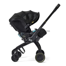 Doona X Summer Canopy in Nitro Black, featuring a sleek design, adjustable canopy, and attached child safety seat.