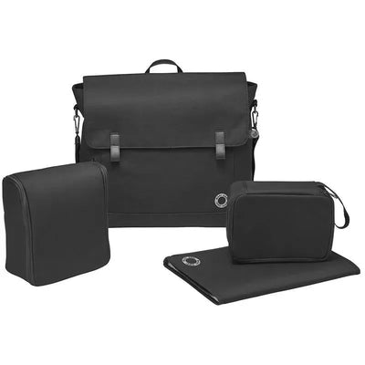 Maxi-Cosi Essential Black diaper bag with zippered compartments and a changing mat, designed for parents on the go.