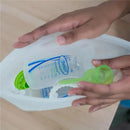 Reusable Dr Brown 100% Silicone Microwave Steam Sterilizer Bag with baby bottles and accessories inside.