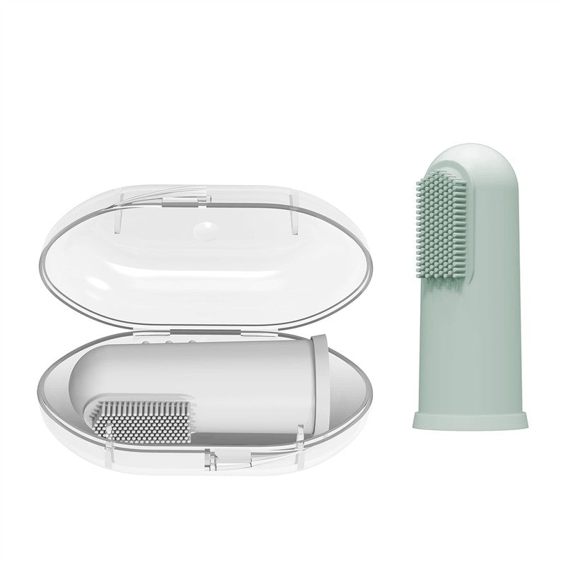 Silicone finger toothbrush in light green next to a white carrying case, designed for infant dental care.