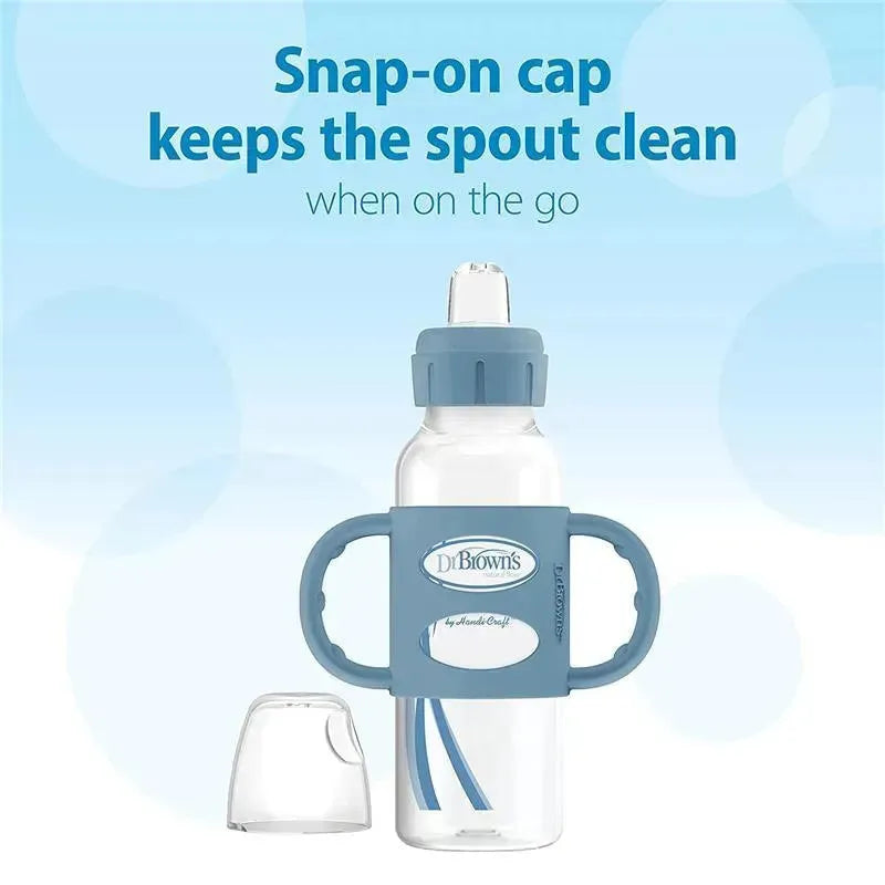 Narrow light blue sippy bottle with silicone handles and snap-on cap, designed for easy grip and spout protection.