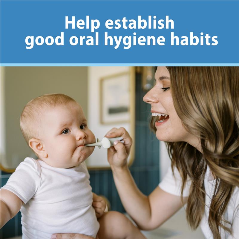 A mother is helping a baby brush their teeth with a training toothbrush, promoting good oral hygiene habits.