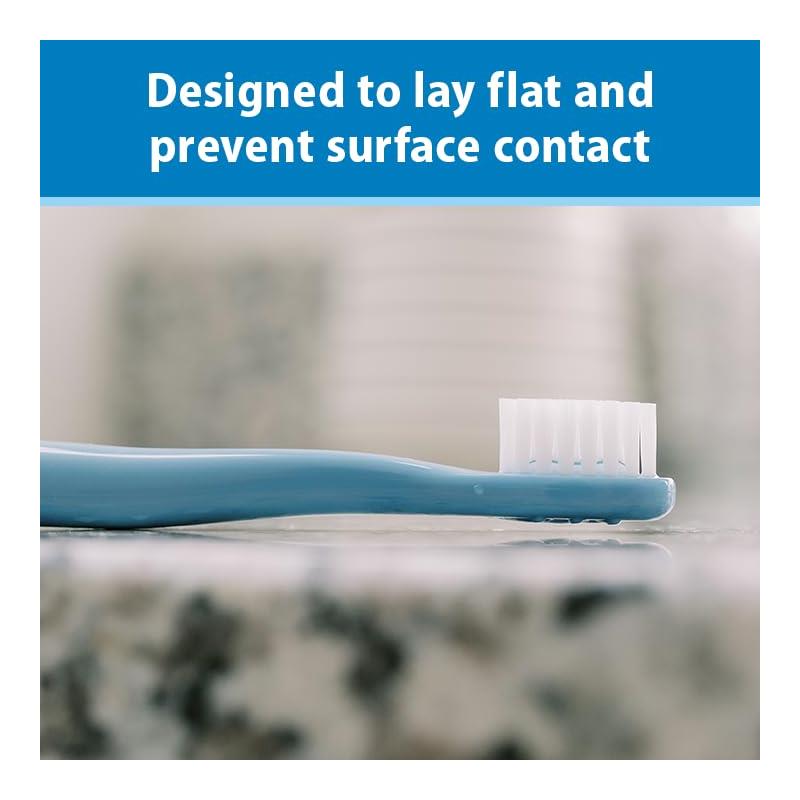 Infant-to-toddler toothbrush set in blue with a design to lay flat and prevent surface contact.