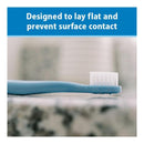 Infant-to-toddler toothbrush set in blue with a design to lay flat and prevent surface contact.