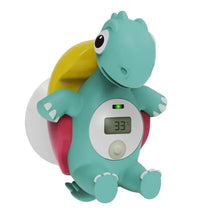 Floating dinosaur-shaped bath thermometer with a digital display showing 33°C, designed for safe bath water temperature checking.