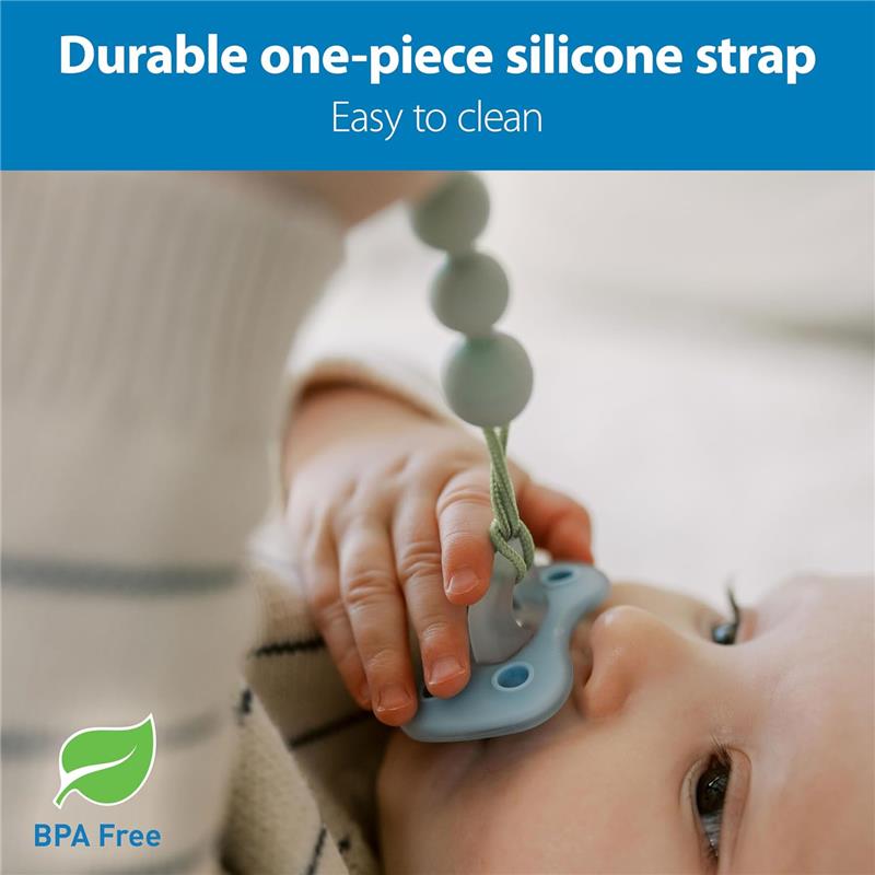 Gray and green silicone pacifier clip held by a baby, featuring a durable, easy-to-clean strap. BPA-free label visible.