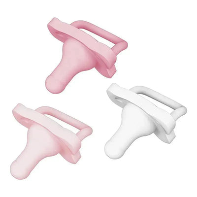 One-piece silicone pacifiers in pink and white, designed for babies, featuring a rounded nipple and handle for easy gripping.