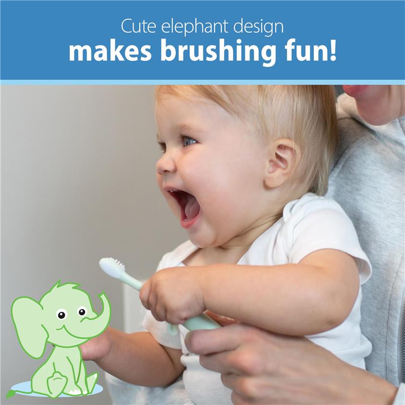 Infant brushing teeth with a mint-colored elephant-design toothbrush, smiling with joy.