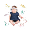 Baby wearing white earmuffs and a hard headband, seated in a denim outfit, with musical instrument illustrations around.