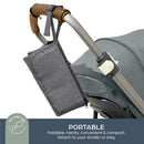 Charcoal-colored Dreambaby change mat attached to a stroller, featuring a portable design and convenient storage.