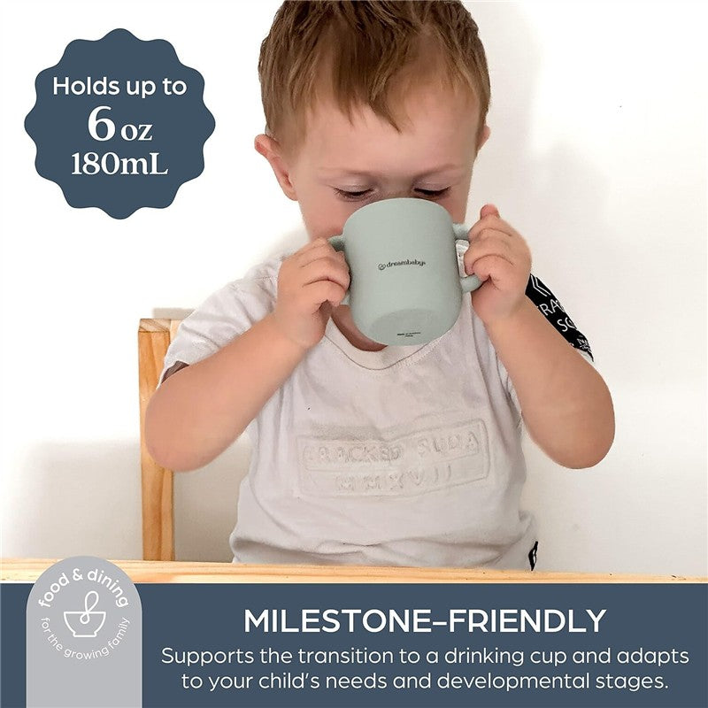 Little boy drinking from a seafoam-colored Dreambaby Drink & Snack Cup, which holds 6 oz (180 mL).