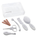 Dreambaby Essential Grooming Kit in white with scissors, comb, brush, nail clippers, and files in a clear case.