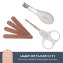Dreambaby Essential Grooming Kit in white, includes a nail clipper, safety scissors, and four nail files for easy child grooming.
