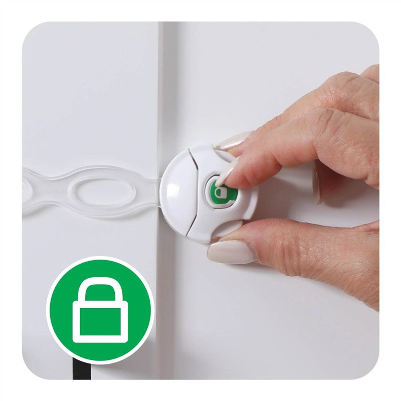 Multi-use latch for child safety, featuring a white design with a green lock button, being activated by a hand.