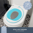 Aqua Dreambaby potty trainer seat features a soft, non-slip design, displayed on a toilet with a decorative floor.