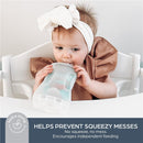 Toddler using a Dreambaby Pouch Pal, designed to prevent mess during feeding, with visible text highlighting its features.