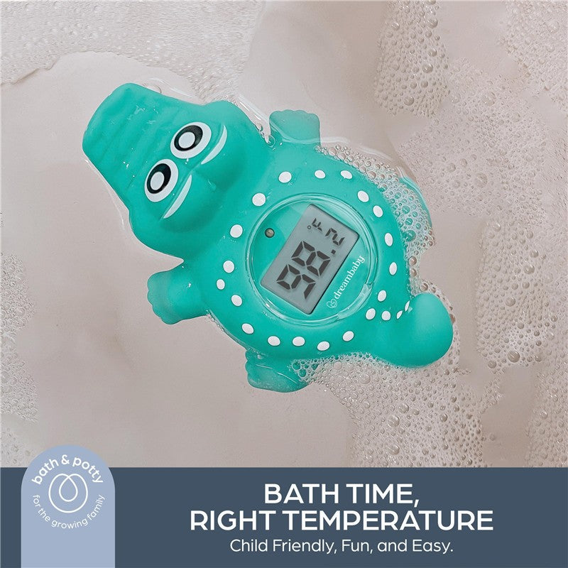 Crocodile-shaped bath thermometer floating in water, displaying a temperature of 88.7°F; child-friendly design.